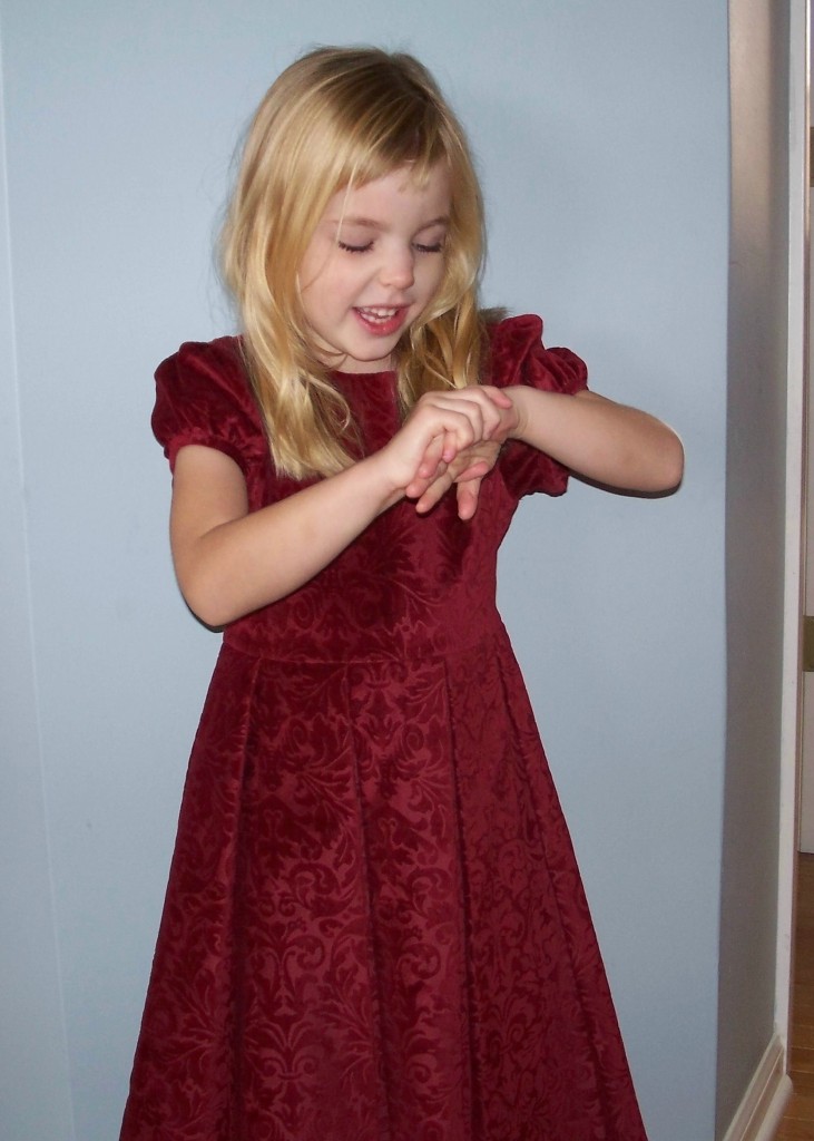 Angel in a red dress at 5 years old. 
