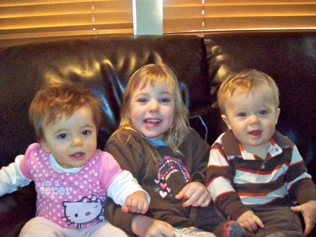 Maddie at 5, with her new to the world siblings. 