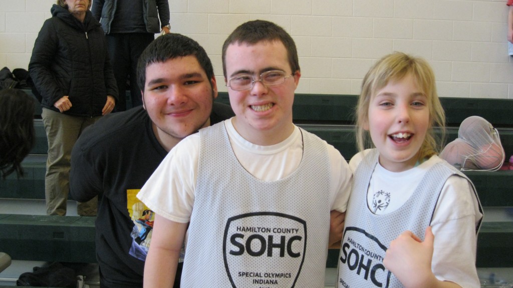 With her friends Robert and John before special olympics bball practice.
