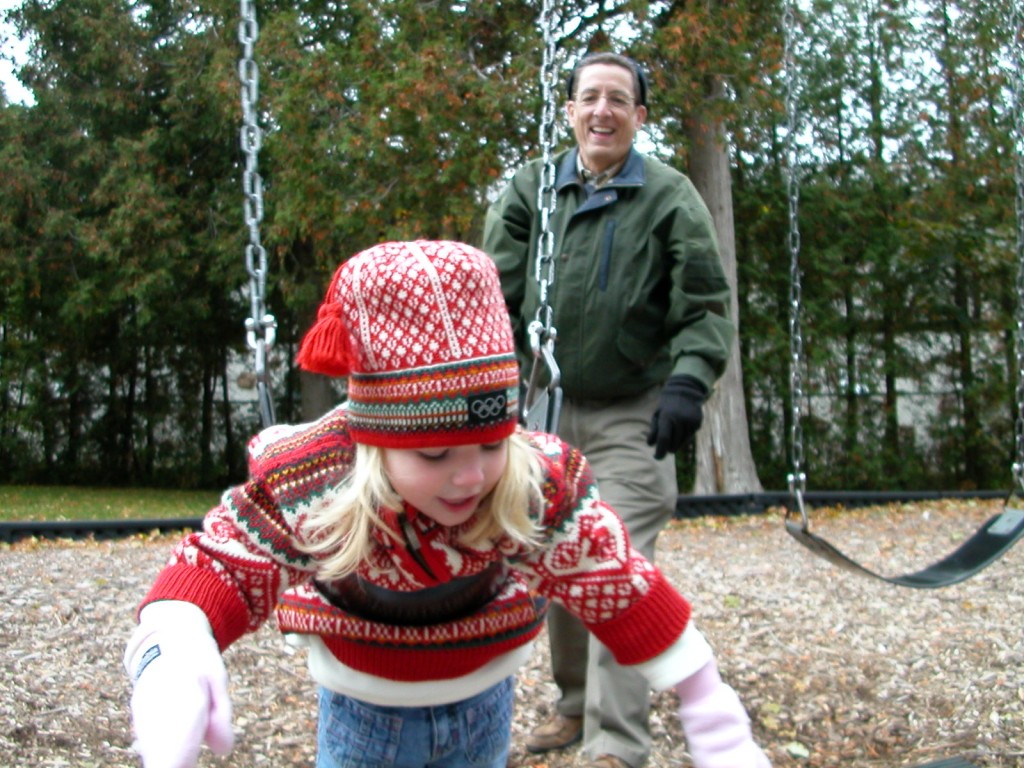 Maddie swinging with Grandpa at 4. At this age this was the only way she could stay on without someone holding her. 